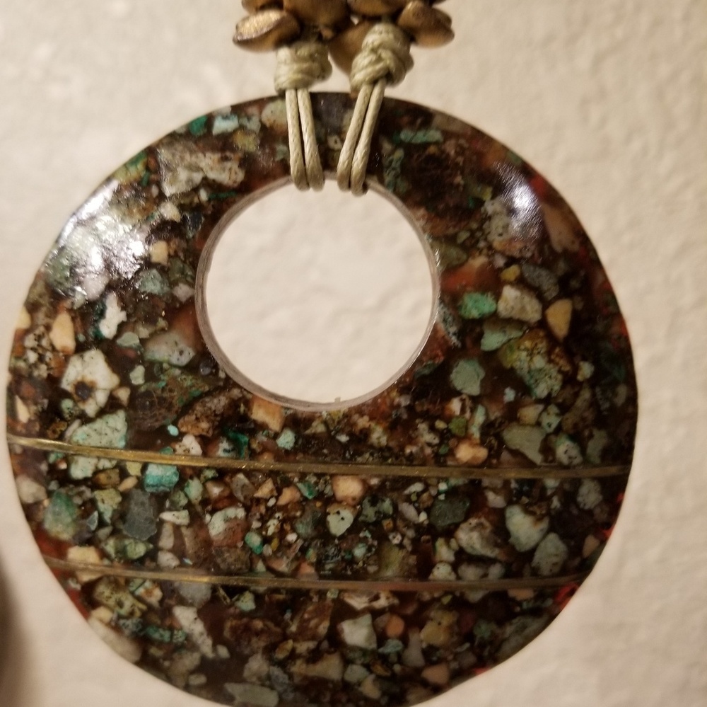 Necklace with resin pendant that looks stone
